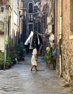 Walking among hanging clothes